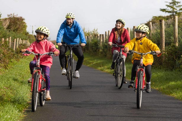 Like Bikes Teacher cycling with three kids