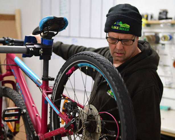 LiKe Bikes Staff Members Performing Bike Repairs