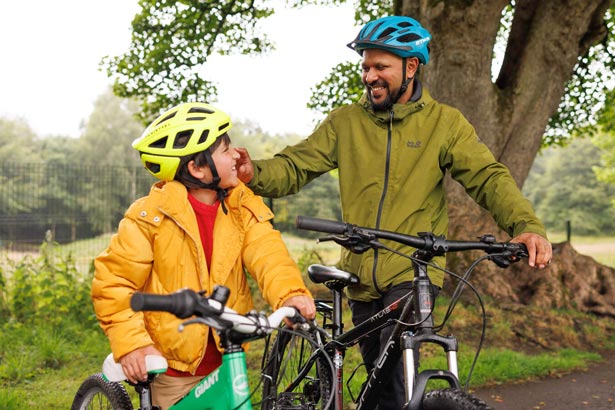 Like Bikes adult and child cyclists chatting